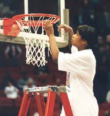 Young Jamelle Elliott cutting down the championship net