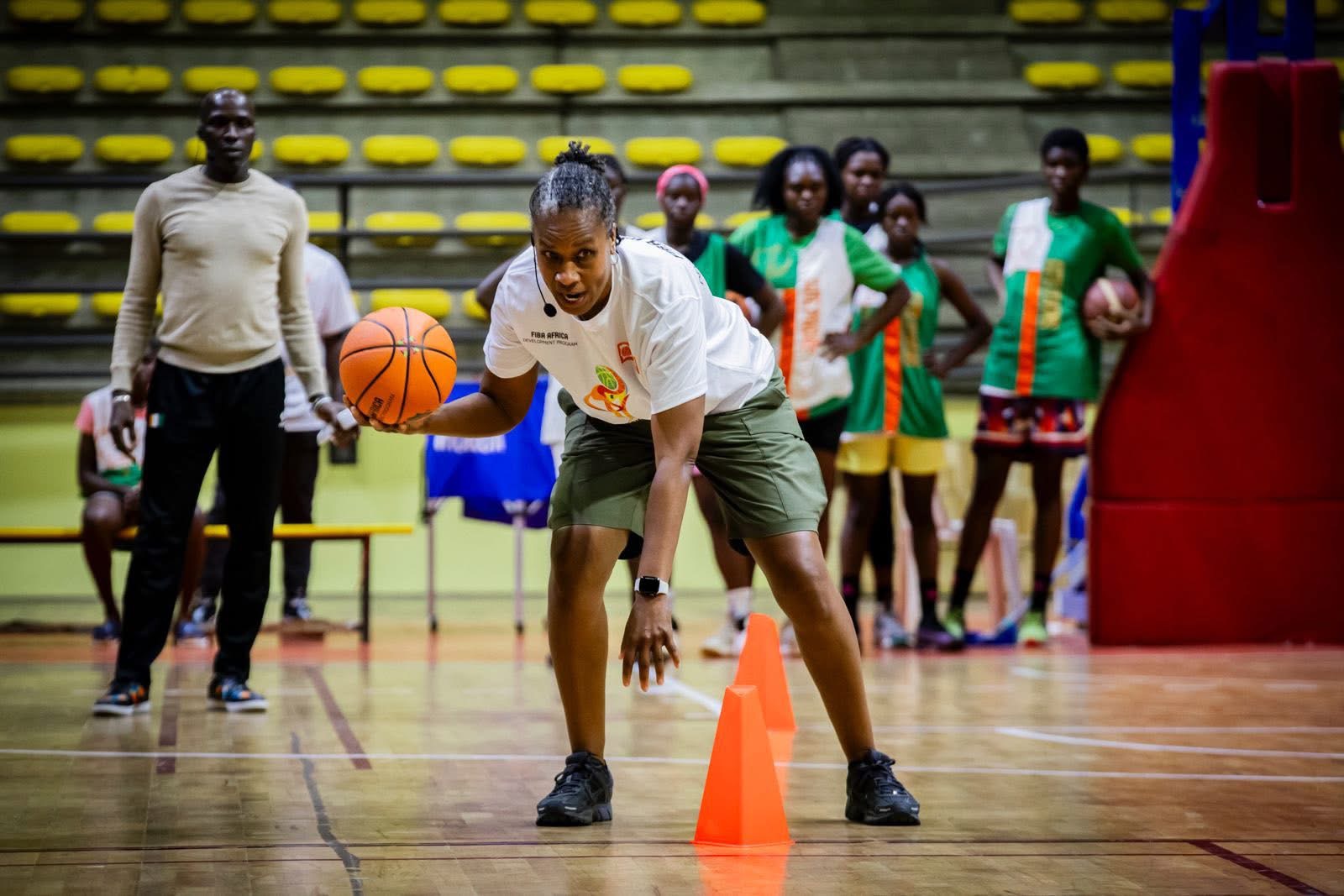 Jamelle Elliott running a clinic drill in Côte d'Ivoire